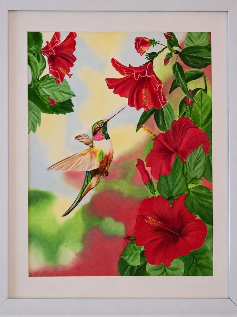 Painting of a hummingbird hovering beside red hibiscus flowers