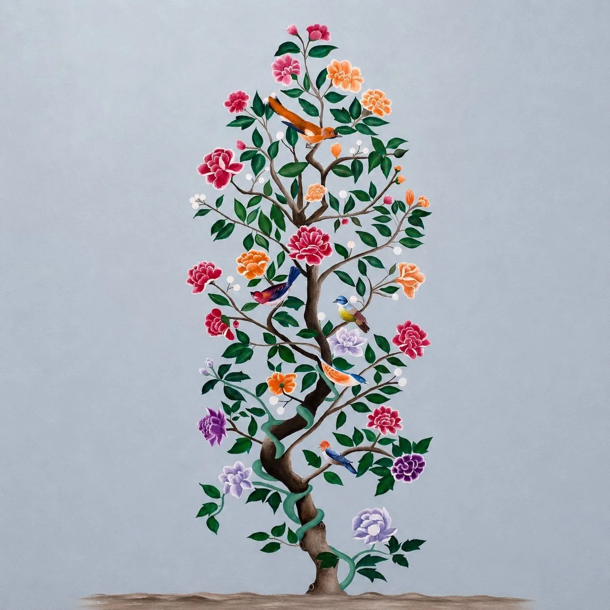 A flowering tree painted directly onto a pale blue wall, with small birds among the branches