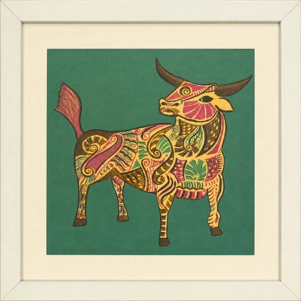 A standing bull filled with floral and paisley patterning, on a deep teal ground